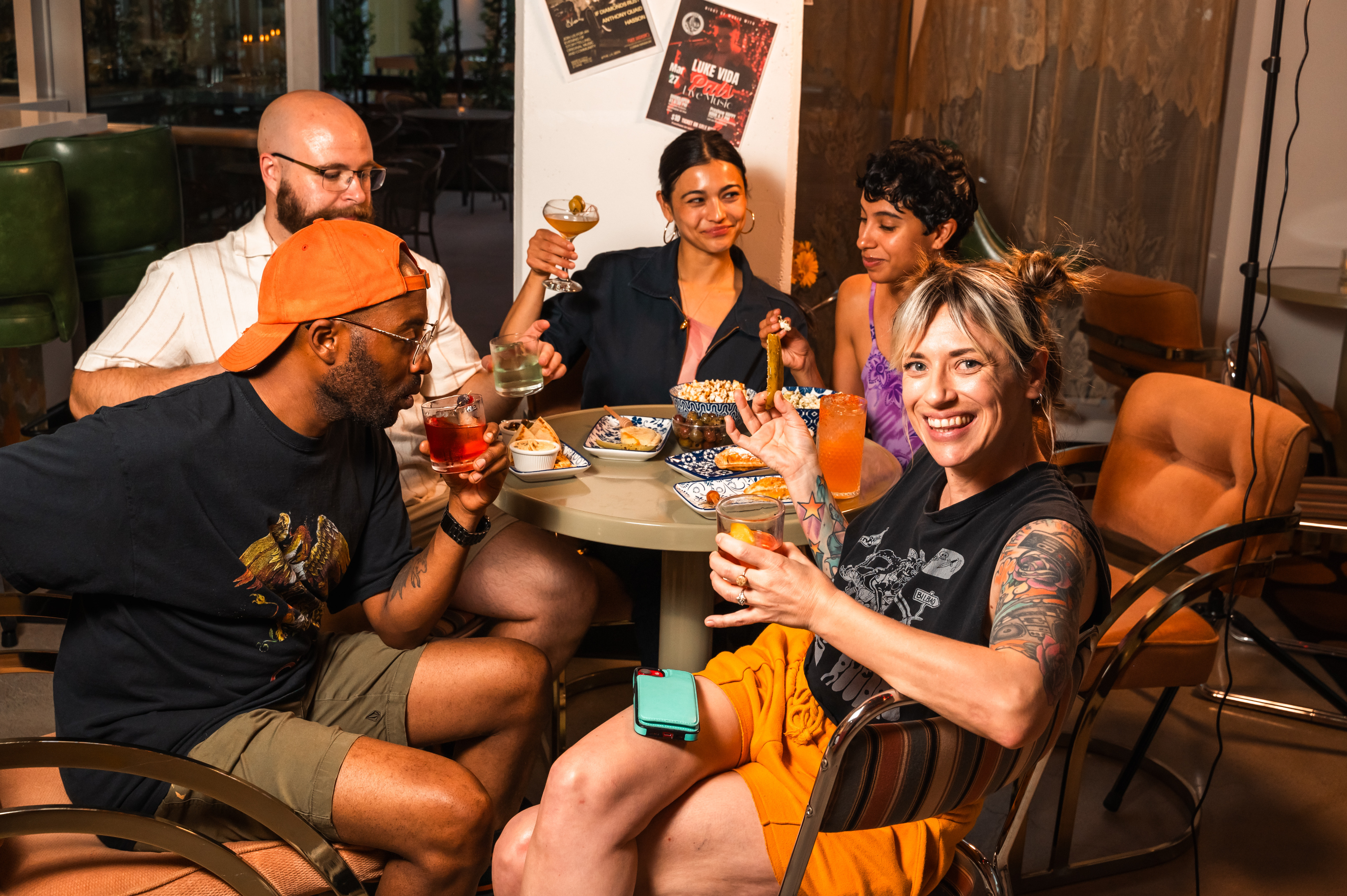 Friends gathered around a table with drinks